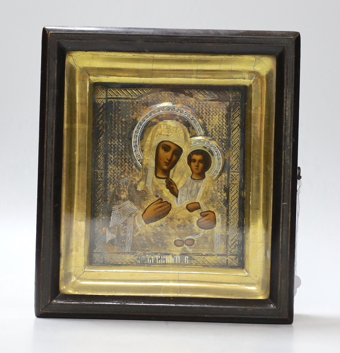 A 20th century Russian painted wood icon of Madonna and Child, with silver-gilt oklad, in gilt frame, 19.5 x 17.5cm